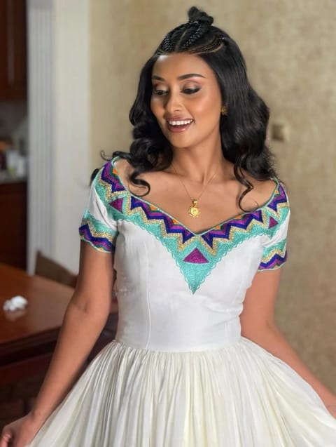 Elegant Habesha DressElegant Ethiopian Habesha Kemis Dress – White Traditional Dress with Turquoise & Purple Embroidery